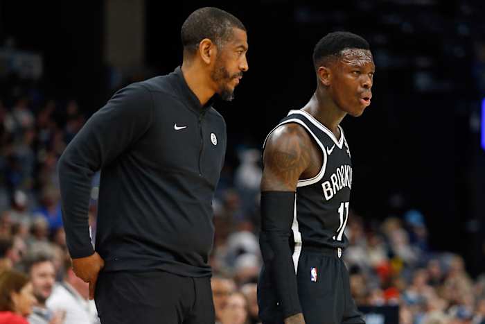 Brooklyn Nets head coach Kevin Ollie (left) talks with Brooklyn Nets guard Dennis Schroder (17)